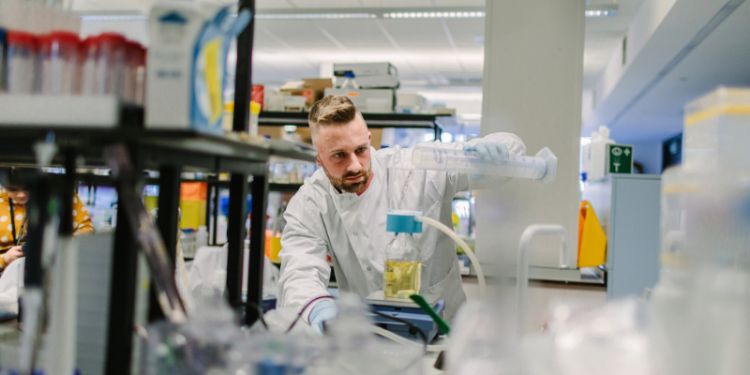 PhD Research student working in lab