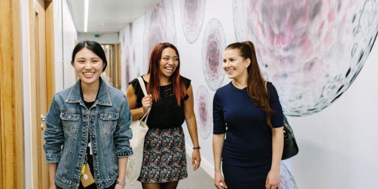 Three students from the Faculty of Biological Sciences global community walking together.
