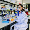 PhD student Michaela Agapiou working in a lab.