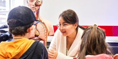 Children talk to researchers at Be Curious