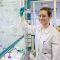 PhD student Emma Cawood writing on a board in a lab at the University of Leeds.