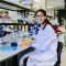 PhD student Michaela Agapiou working in a lab.