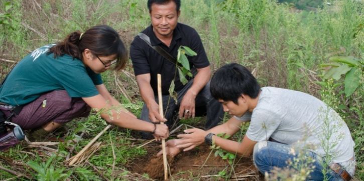 Students working with a global community