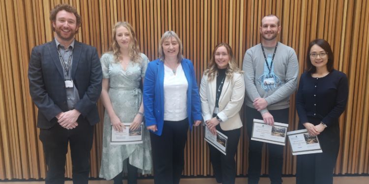 Dr james warren ella scallan professor karen birch dr emily byrd matthew harwood and dr aiqin liu smile at the camera