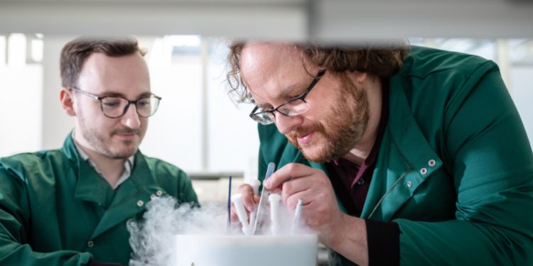 Scientists conducting an experiment